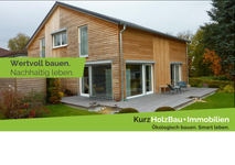 Referenzhaus mit Holzfassade und Holzterrasse
