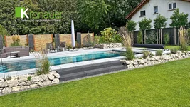 Privatgartengestaltung mit Keramikterrasse, Pool und Natursteinarbeiten